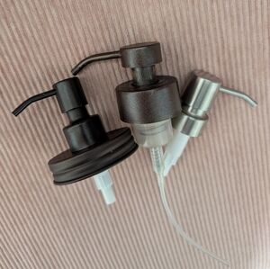 Set of Bronze and Silver Pump Dispensers